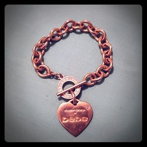 Bebe gold colored bracelet with rhinestones